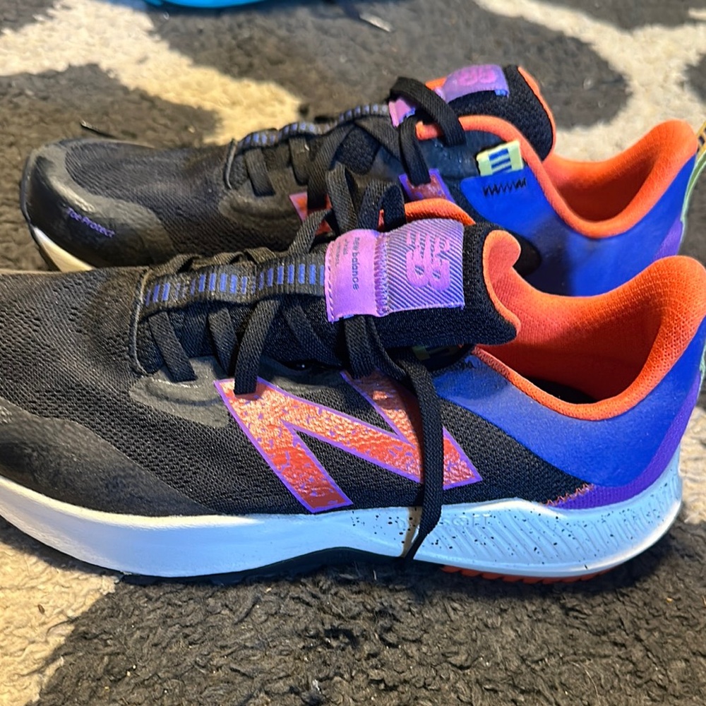 New Balance Black and Purple Sneakers with Mesh Upper and Ergonomic Sole